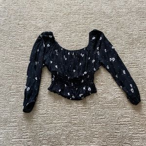 Black crop top with white flowers from tillys.